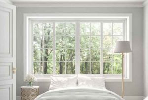 Bedroom of luxury house decorated with white window, white flower pot and white light lamp.